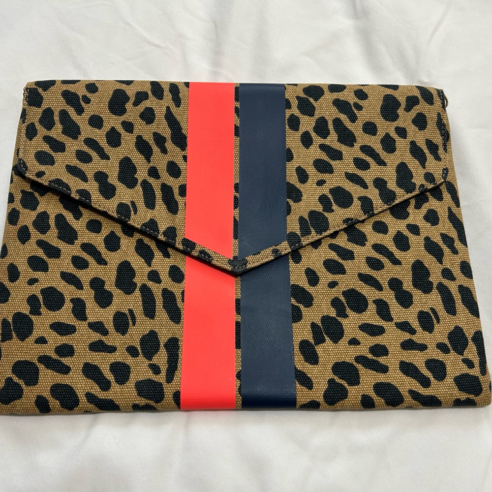 Stella & Dot Leopard Print Clutch with Red and Black Stripes. Never been worn.